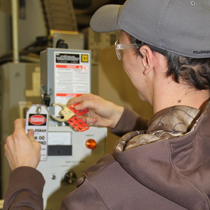Student working with an electrical box